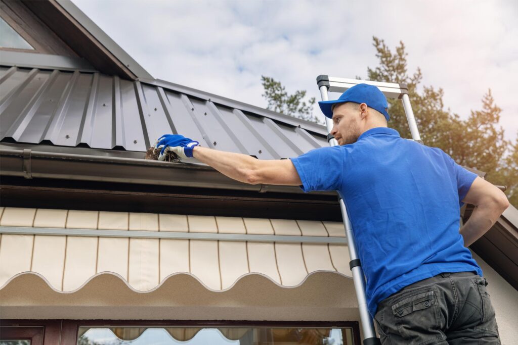 goonlinetools homeguide handyman cleaning gutters on residential house